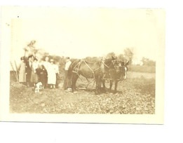 old image of people and horses